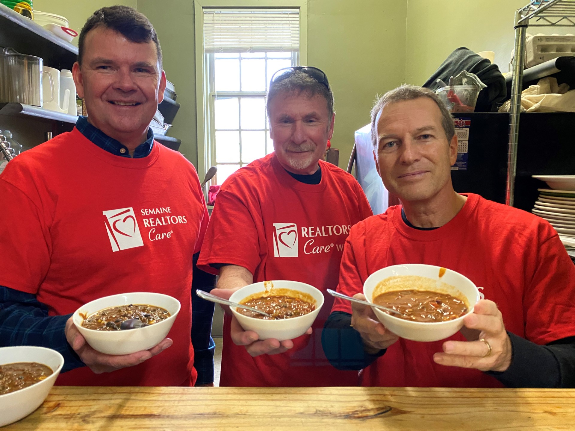 CREA staff and members serve chili at Centre 507