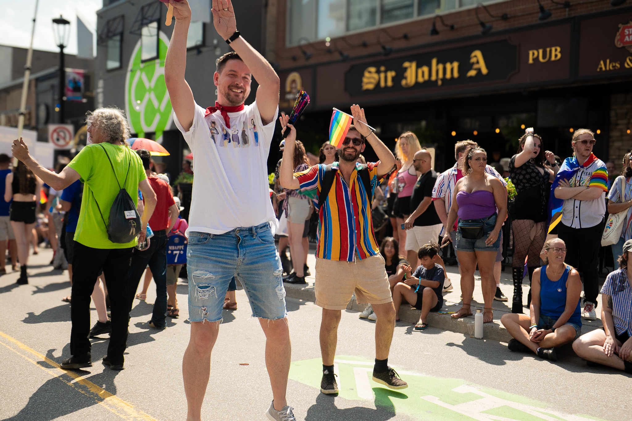 Martin SImard dancing with his hands up in Ottawa pride parade